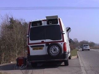 23Mar03 - surveillance van recording vehicle registrations and possibly biometrics on the A417 west of Fairford, Gloucestershire, UK.